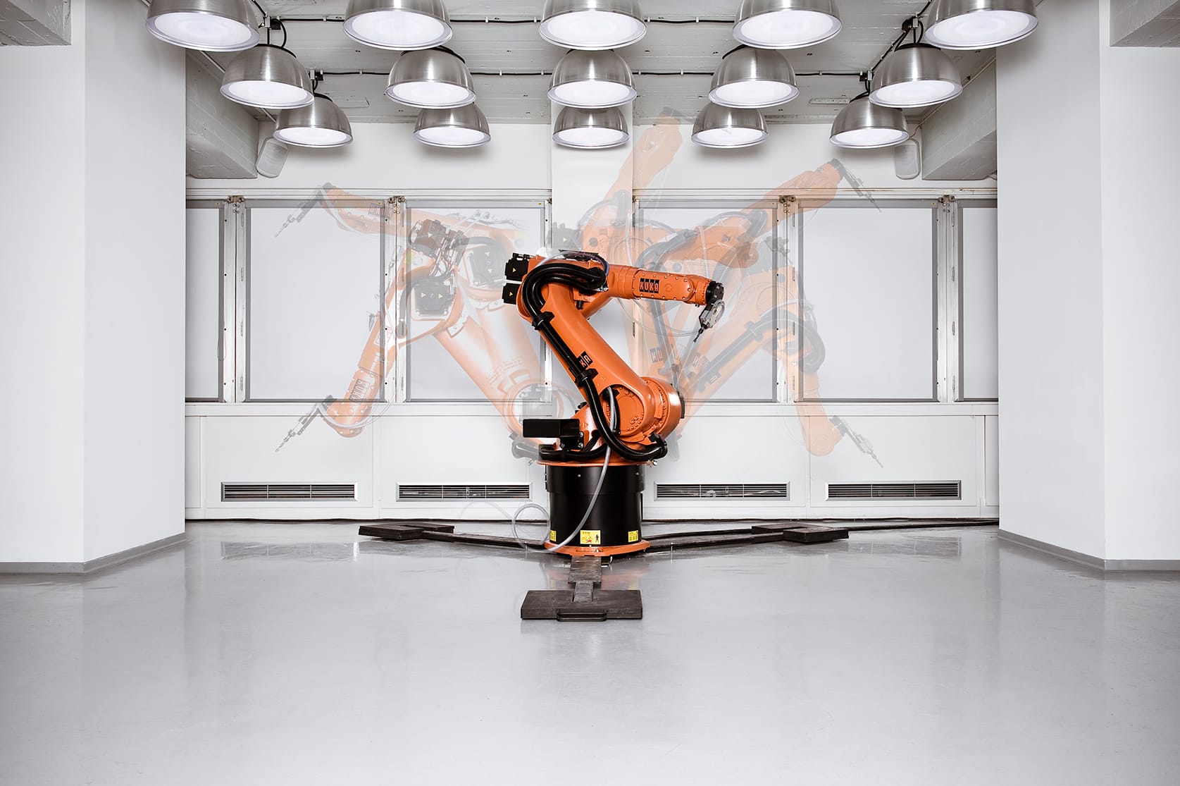 The KUKA robot, performing choreographed live manufacturing